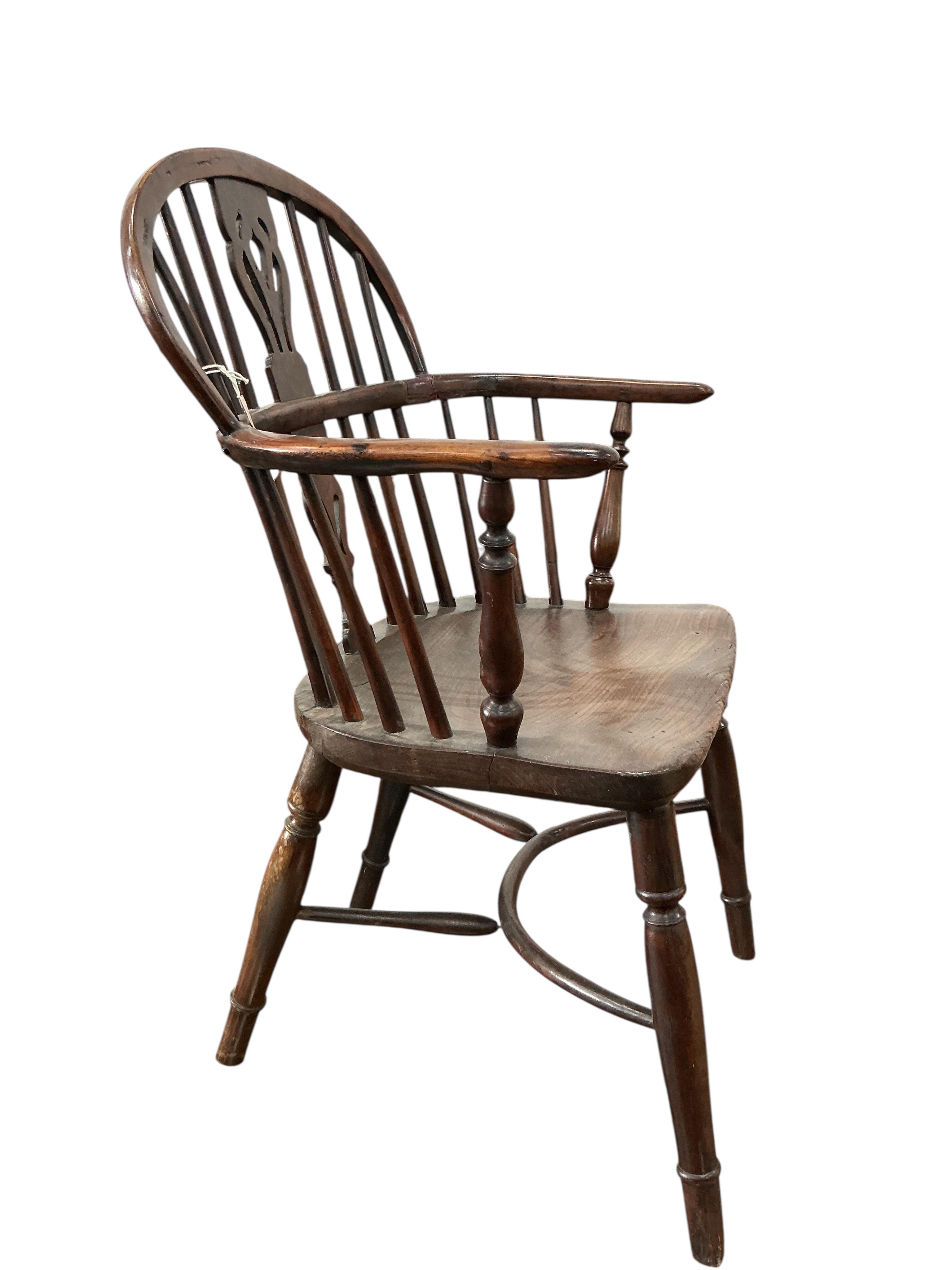 A mid 19th century yew, elm and ash Windsor chair, with pierced splat and crinoline stretcher, width 55cm, depth 40cm, height 88cm
